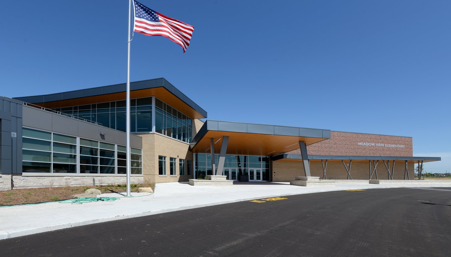 meadow view elementary entrance with flag