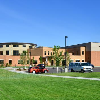 Wide shot of Lunda Community Center on a bright day