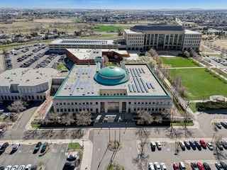 aerial view of aurora municipal court featuring solar panels on roof