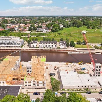 river house apartments 3 & 4 during construction with milwaukee river behind