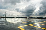 storm clouds and a wet concrete surface
